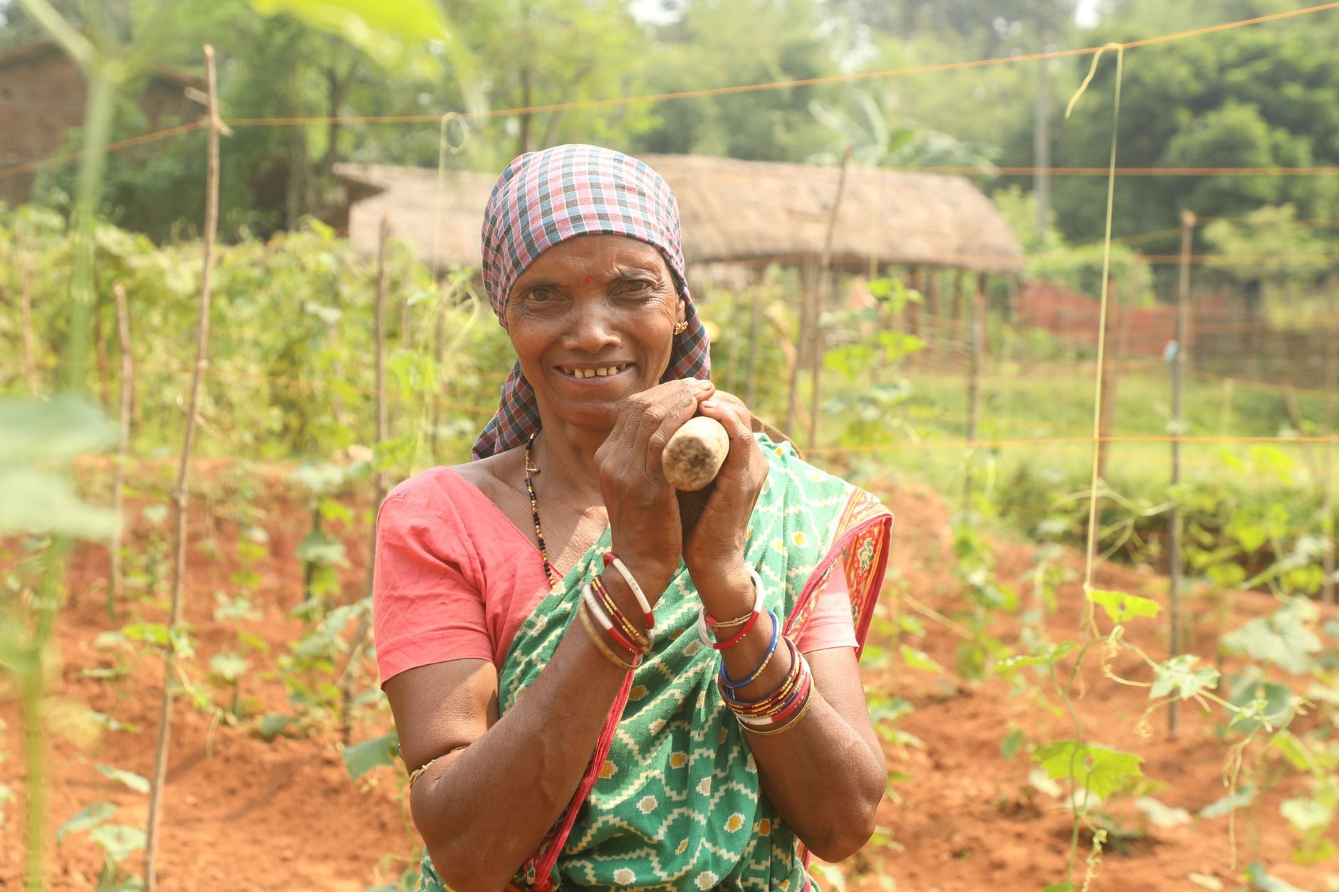 Farmer smiling in her garden
